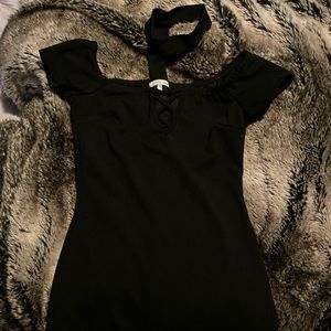 Mid length black dress with choker collar